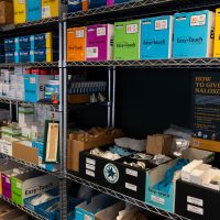 Close-up of a row of supply shelves in a syringe services program.