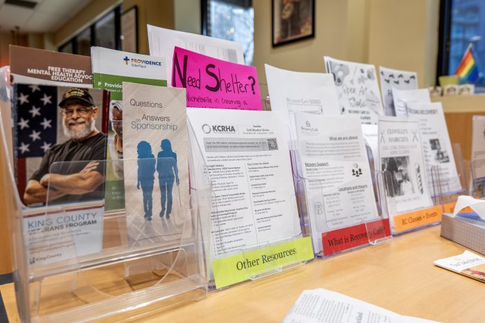 Brochure stand with informational materials for visitors of a recovery support organization