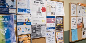 Bulletin boards on the wall of a recovery support organization with health resources and classes and events