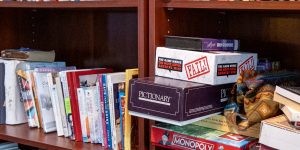 Shelf of books and games in a recovery support organization
