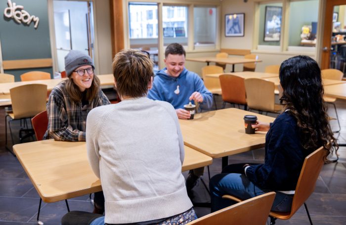 Group of people at a table in a recovery support organization