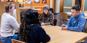 Group of people at a table in a recovery support organization