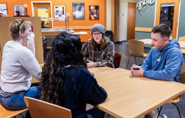Group of people at a table in a recovery support organization