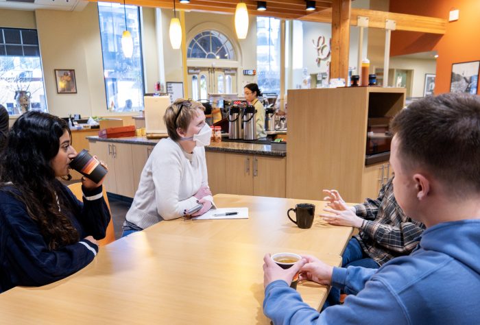 Group of people at a table in a recovery support organization