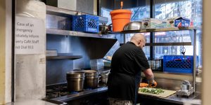 A chef working in the kitchen of a recovery services organization